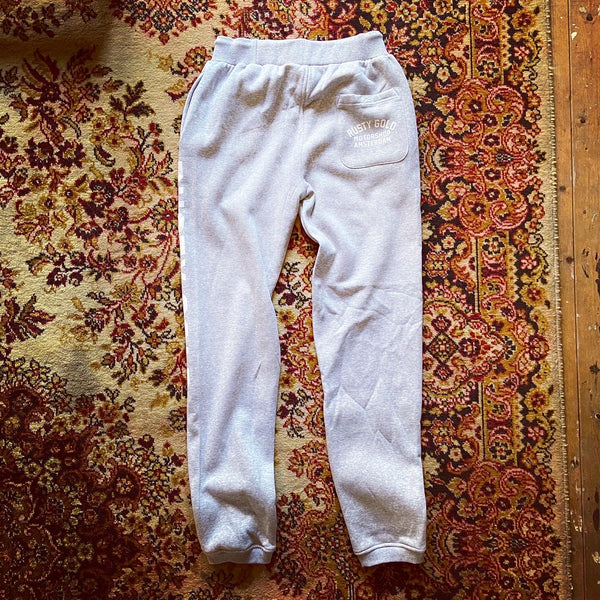 White sweatpants with store pockets